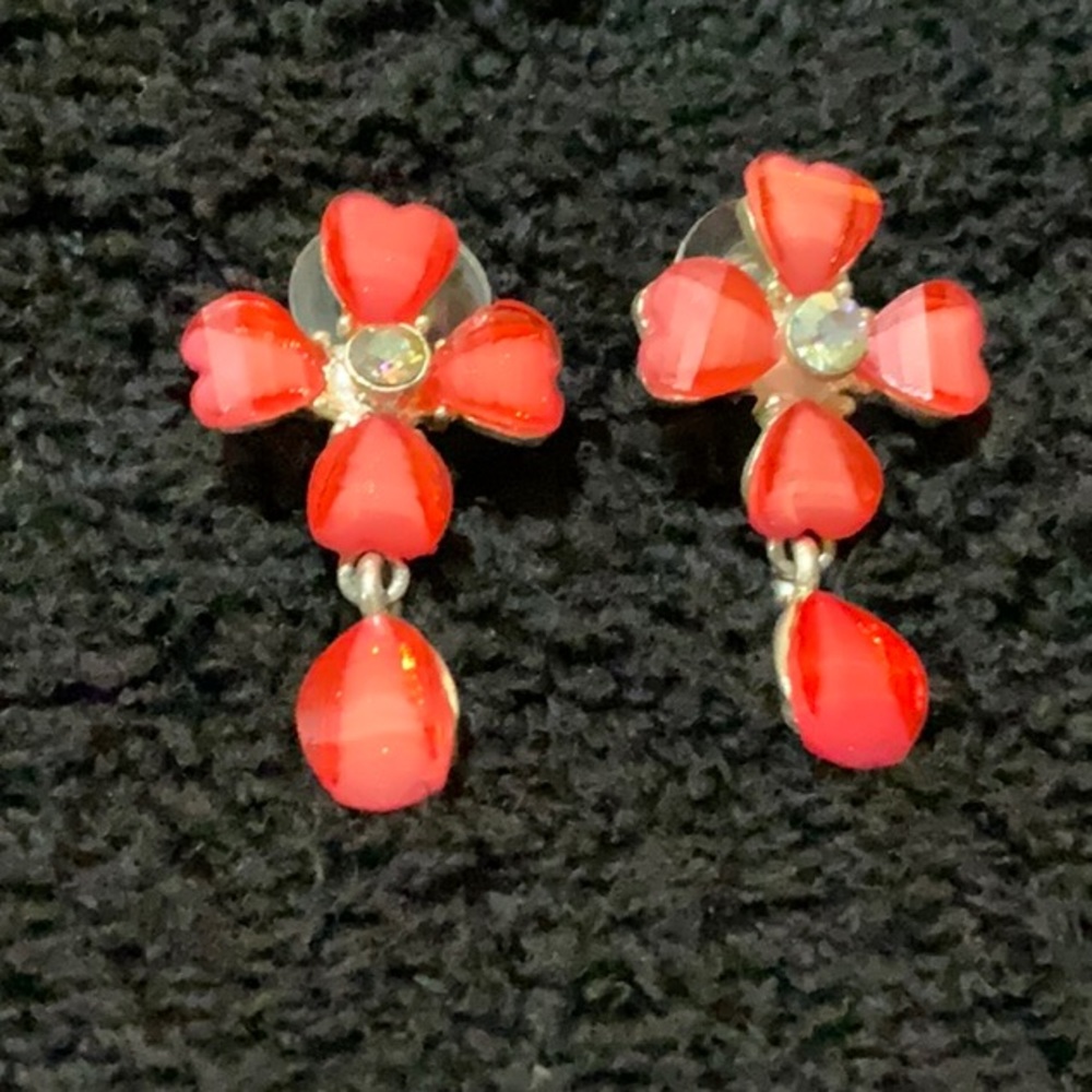Pink heart shaped earrings.